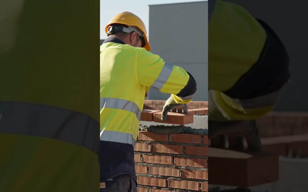 Bricklayer in hi vis and hard hat laying bricks, from Safety Man Dan Silica Awareness Part 1